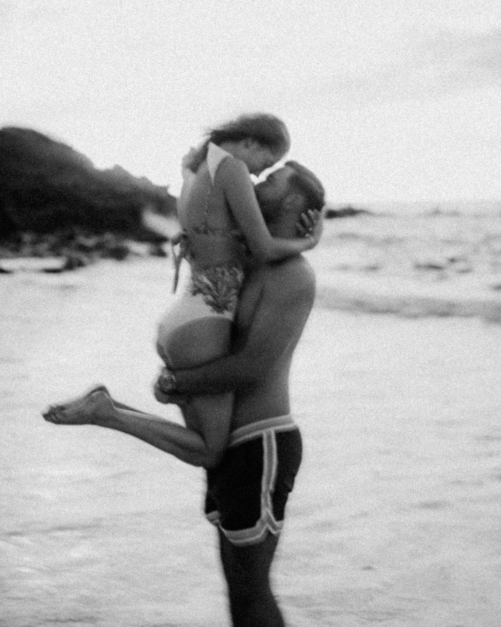A black and white portrait of a couple in Maui