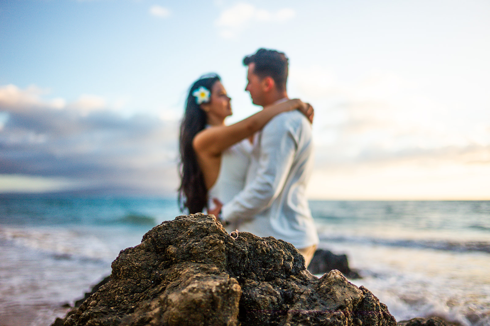 Newly engaged couple celebrating together on a Maui beach