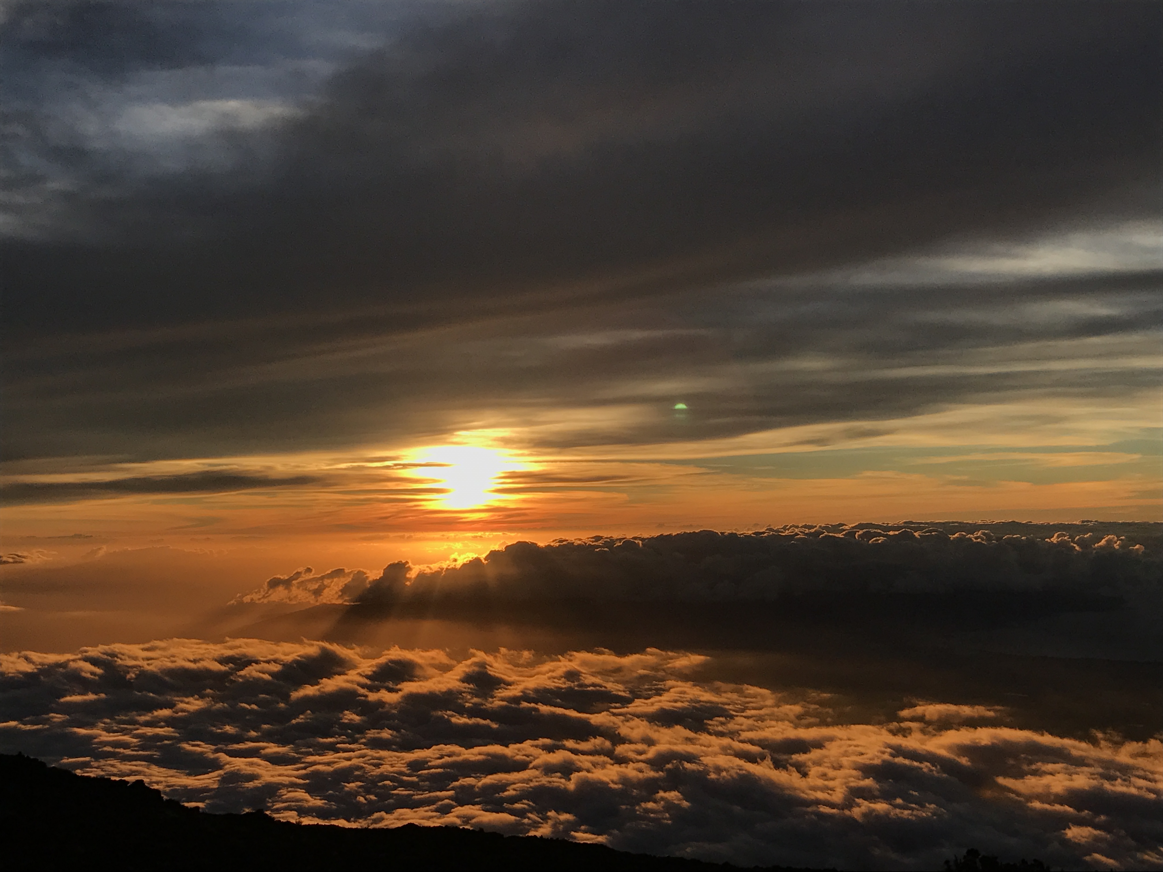 Sunset above the cloud layer at the Haleakalā summit