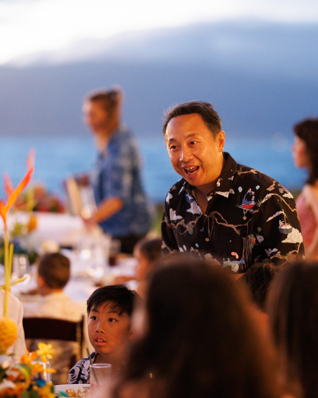 A candid moment at a Maui family reunion farewell dinner at the Wailea Beach Resort