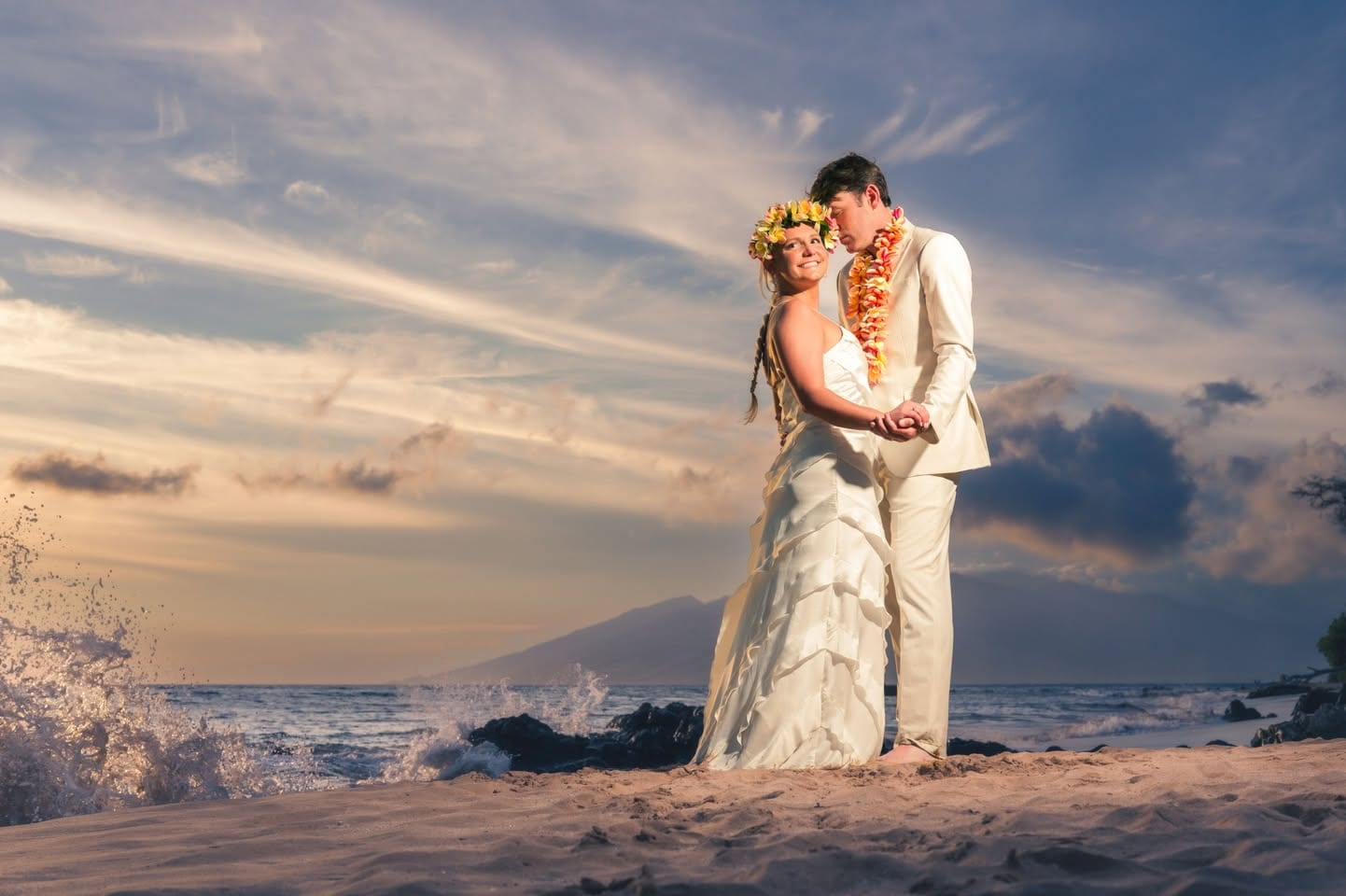Wedding couple photographed at sunset on Mokapu Beach in Wailea, Maui