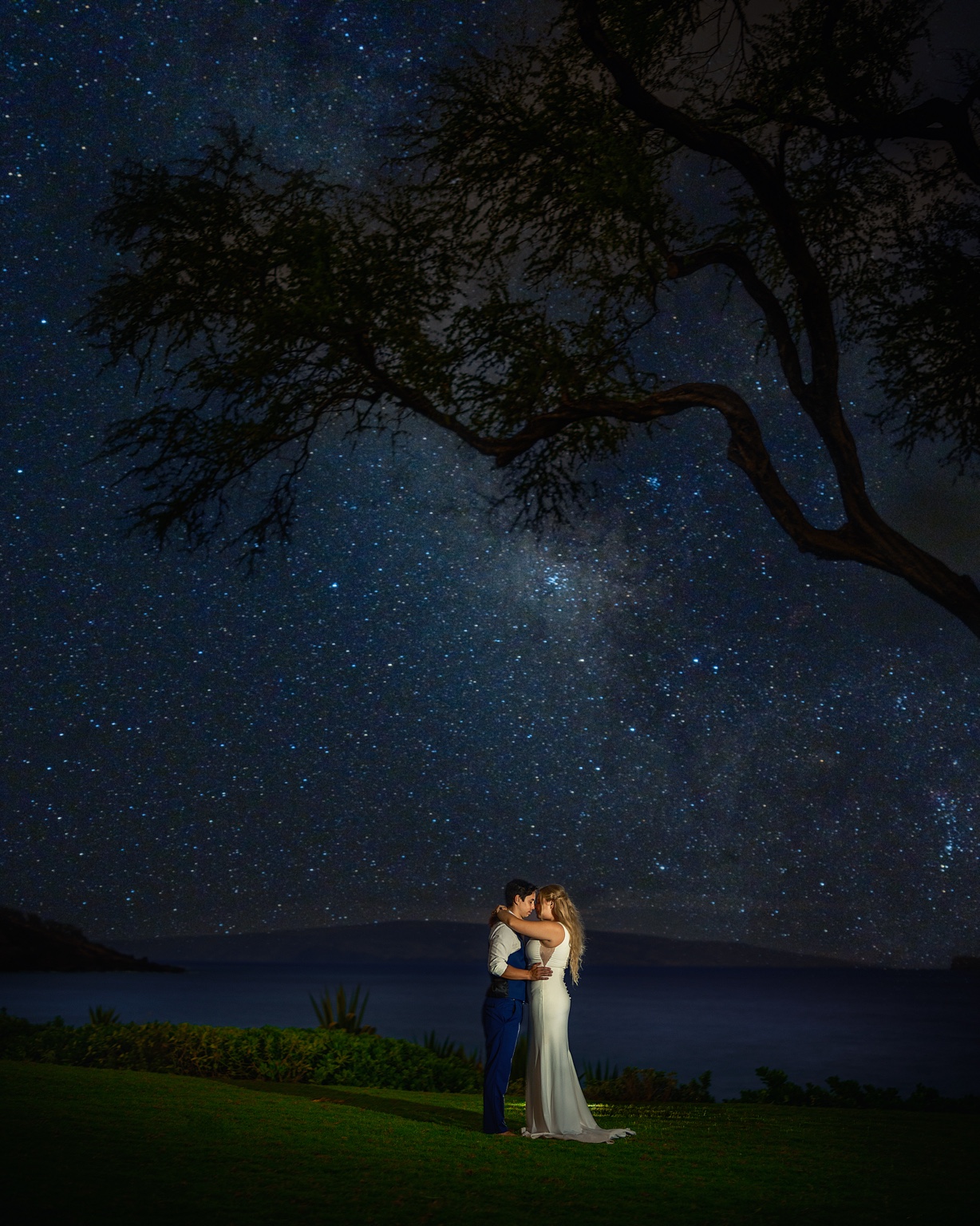 A couple beneath the Milky Way in Maui