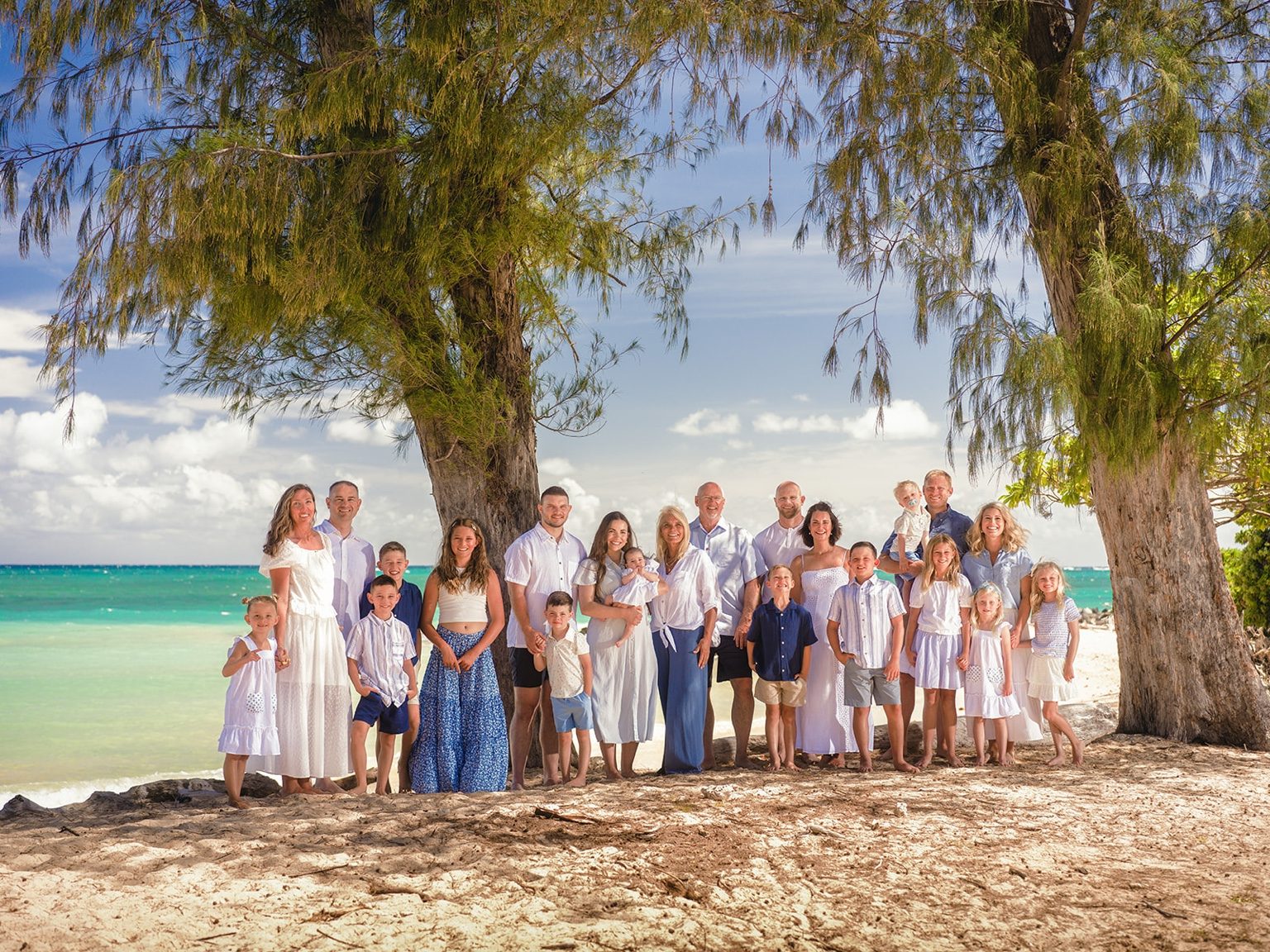 The Large Family Legacy portrait session beside turquoise water