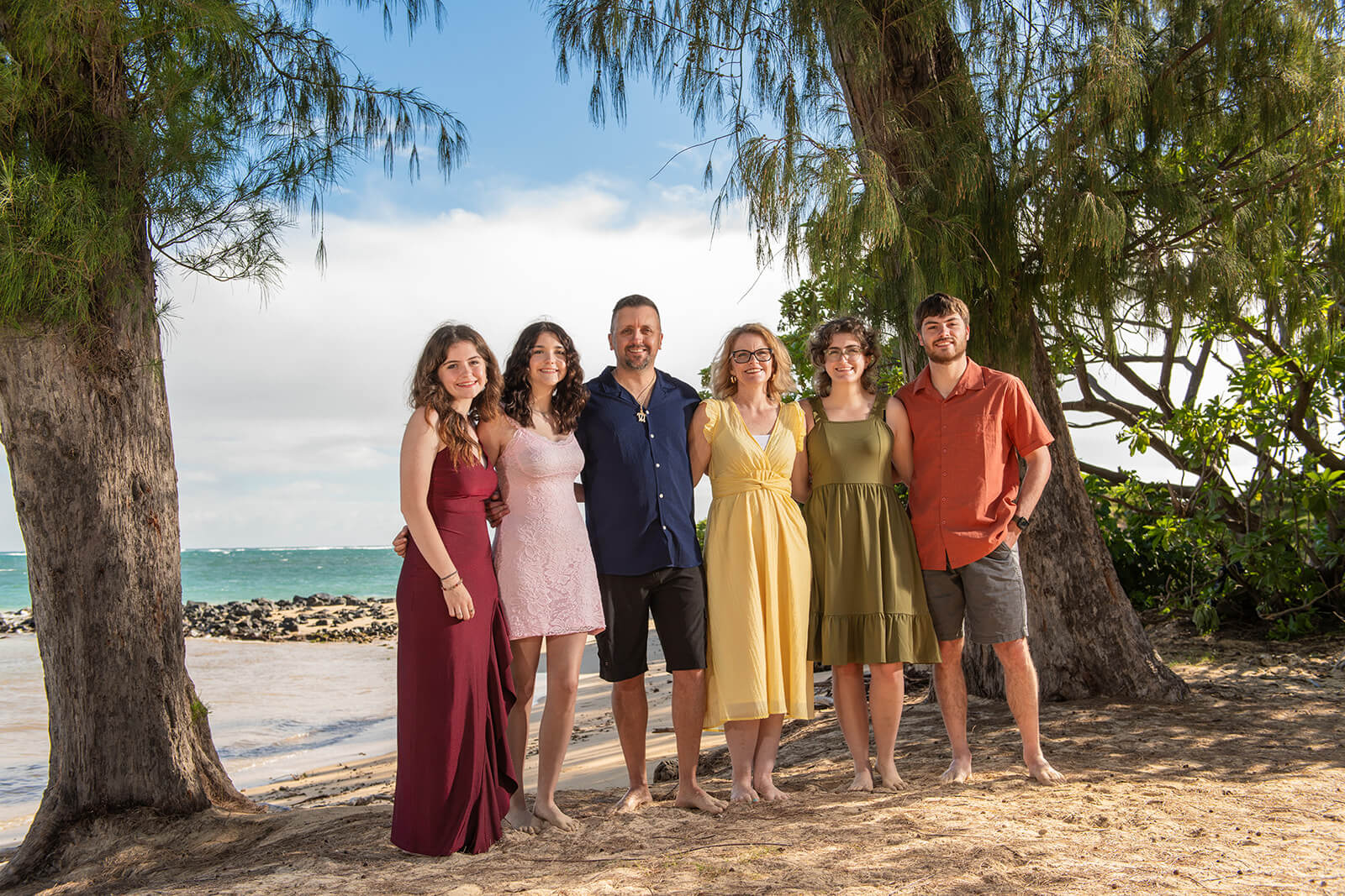 The Large Family Legacy portrait session with bold colors by turquoise water