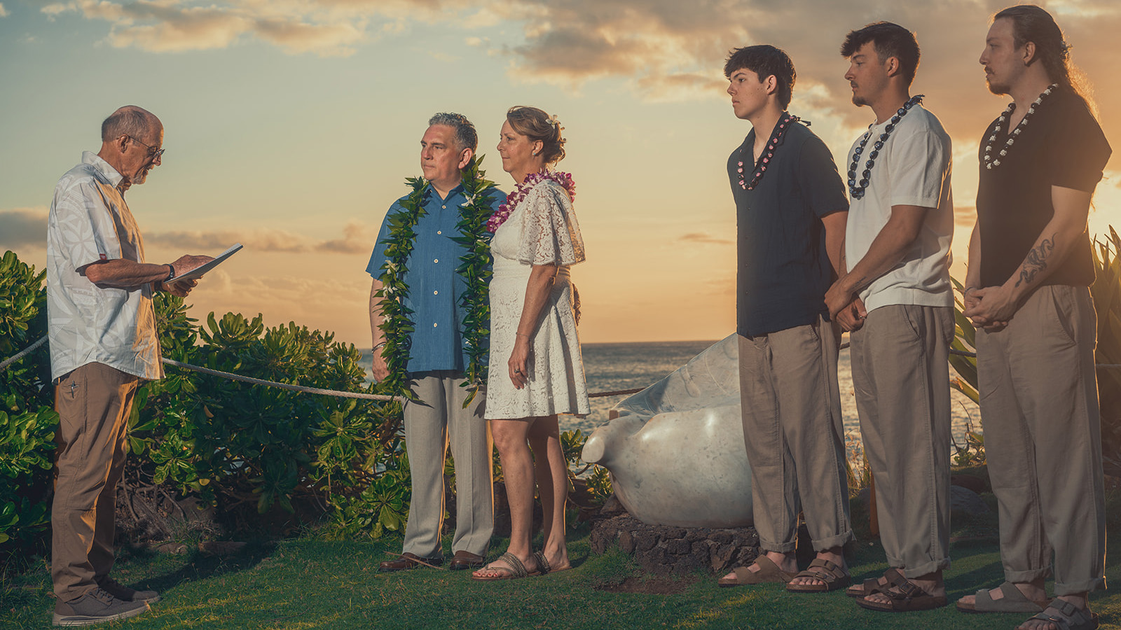 A couple celebrating their vow renewal beside the ocean in Maui
