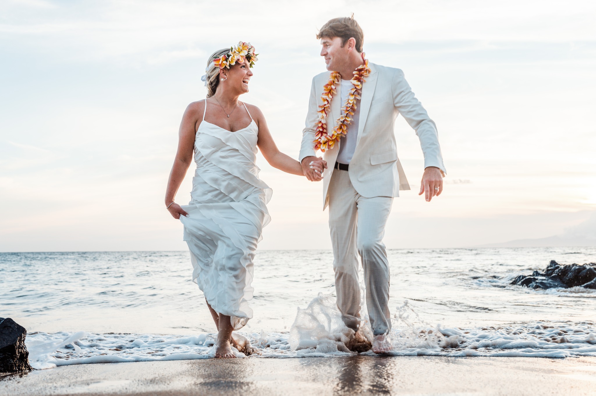 A wedding couple photographed together on a Maui beach